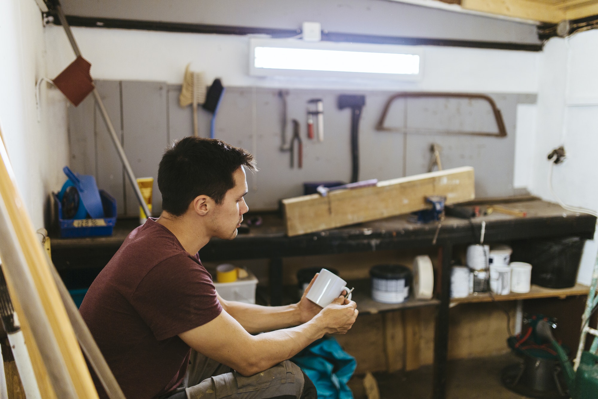 Man sitting in garage